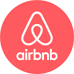 Airbnb logo: white abstract symbol on a red background with the word "airbnb" underneath.
