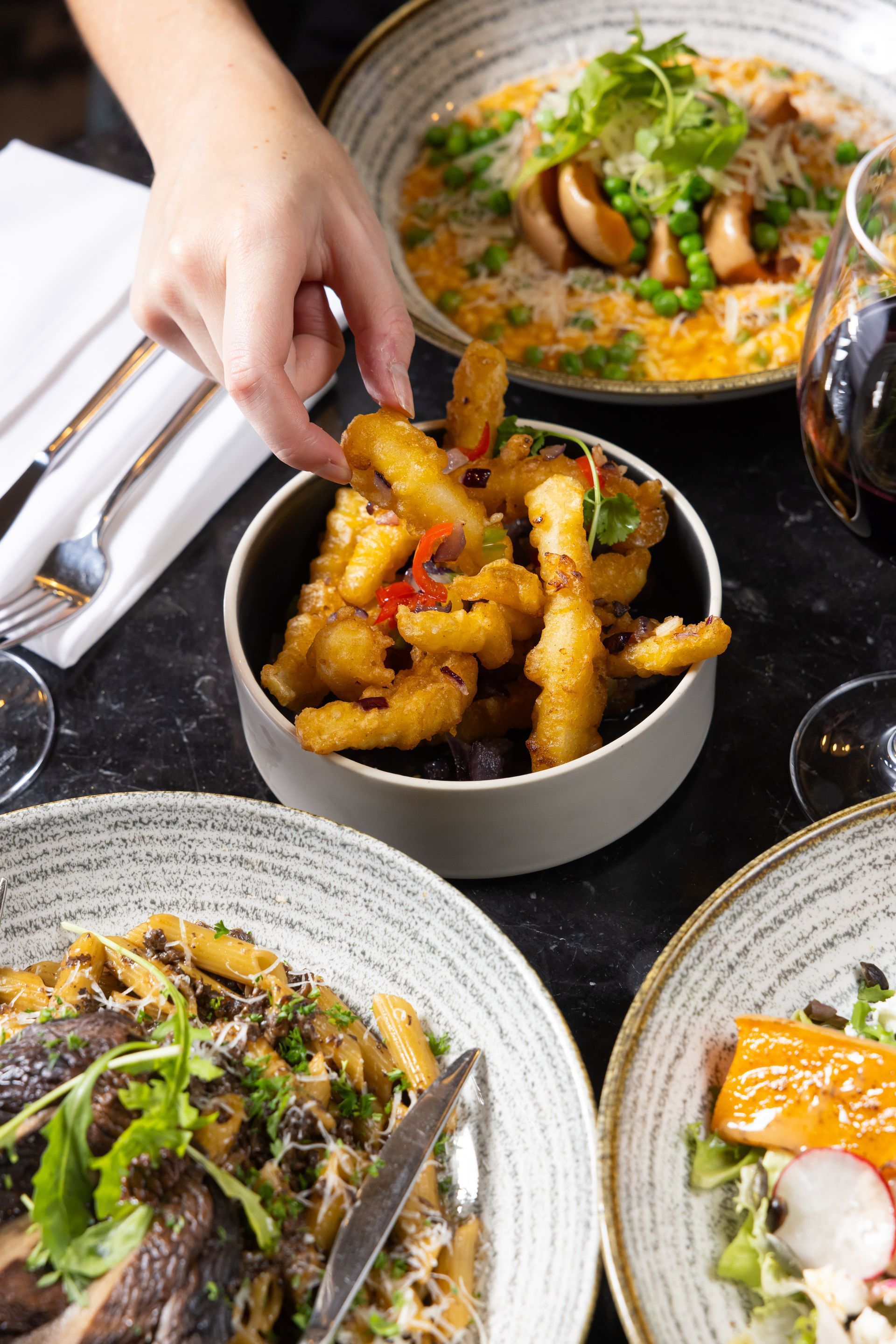 fried delicious food in a white bowl on a table