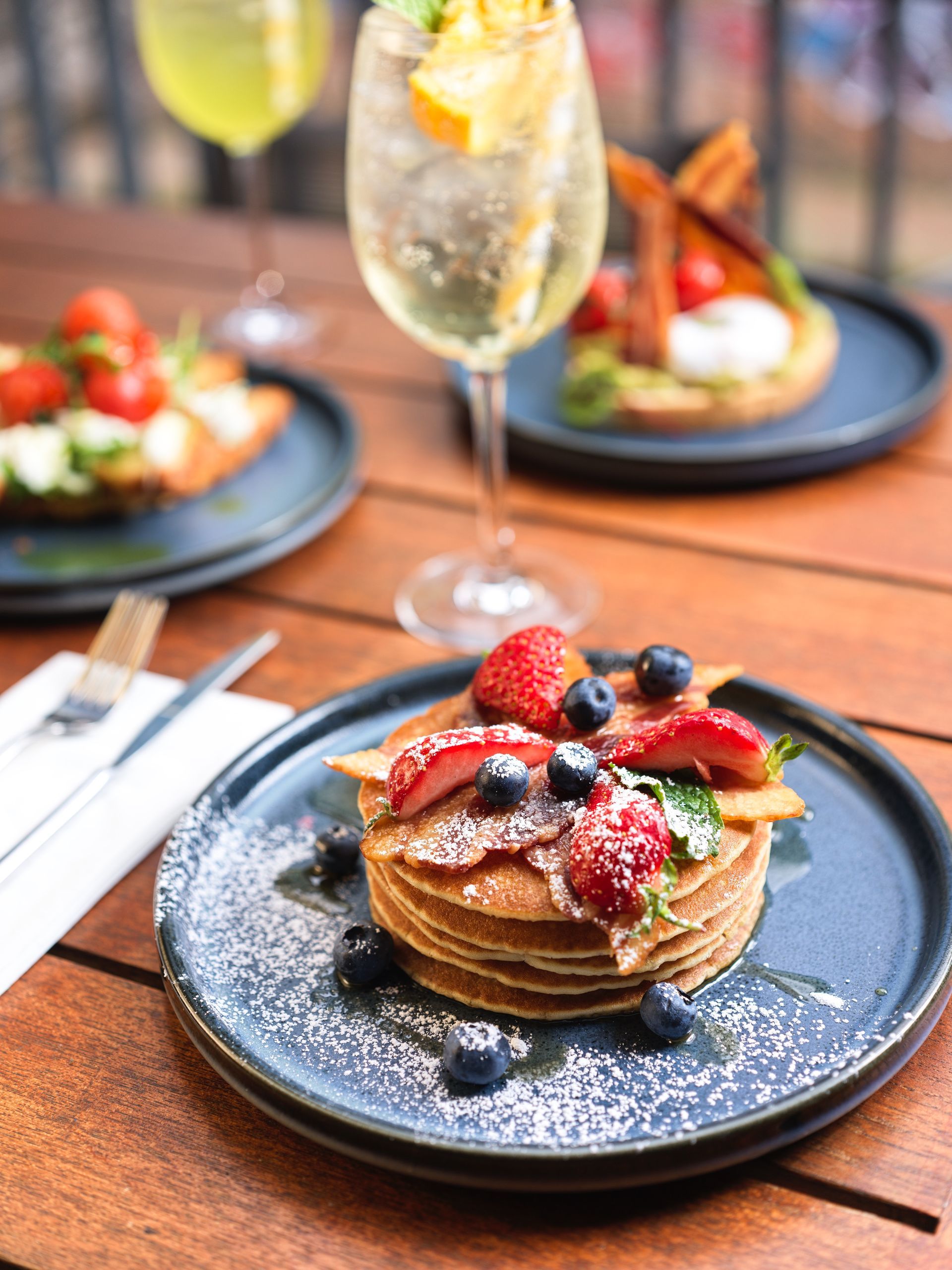 sweet bakery with strawberries and blueberry on a dark plate