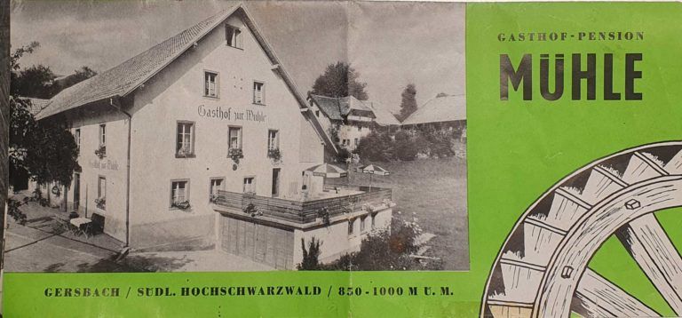 Vintage-Etikett in Grün und Schwarz mit einer Hausillustration und dem Wort „MUHLE“ um ein Diagramm eines Mühlrads