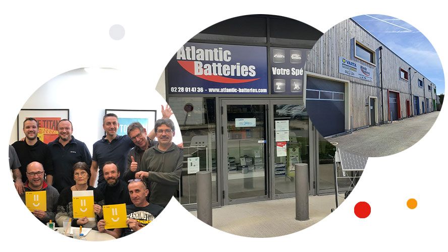 Équipe d'Altantic Batteries souriante et magasin de Rezé