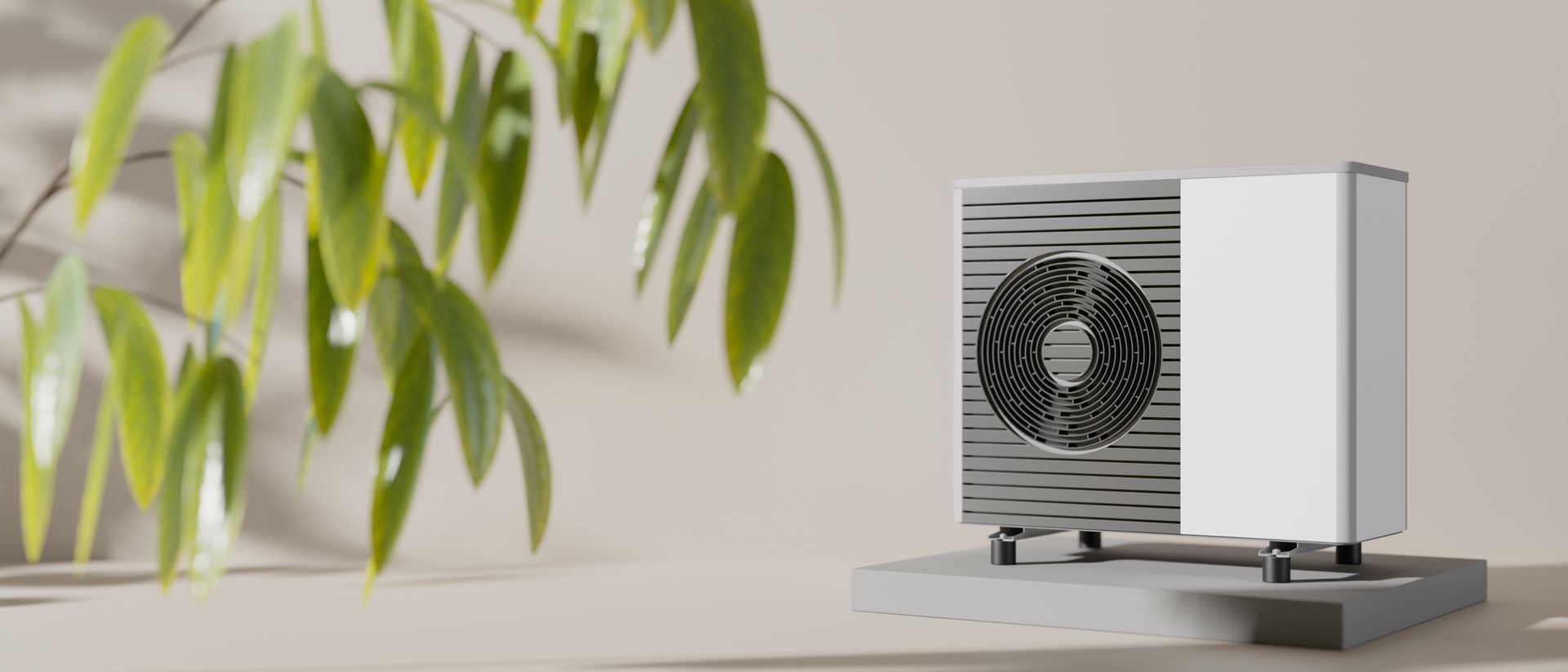 Une unité de pompe à chaleur avec une plante à côté