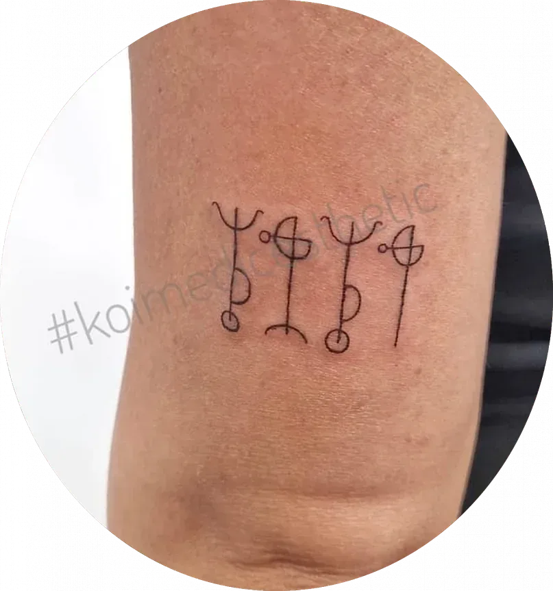 Un tatuaje en el brazo de una persona que dice 