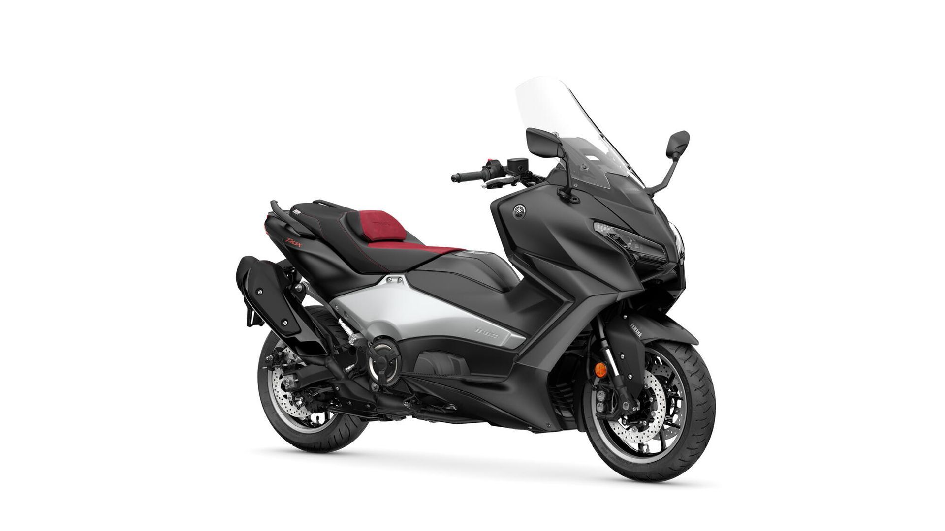 Scooter de tourisme noir et gris avec pare-brise, rétroviseurs latéraux et selle rouge sur fond blanc