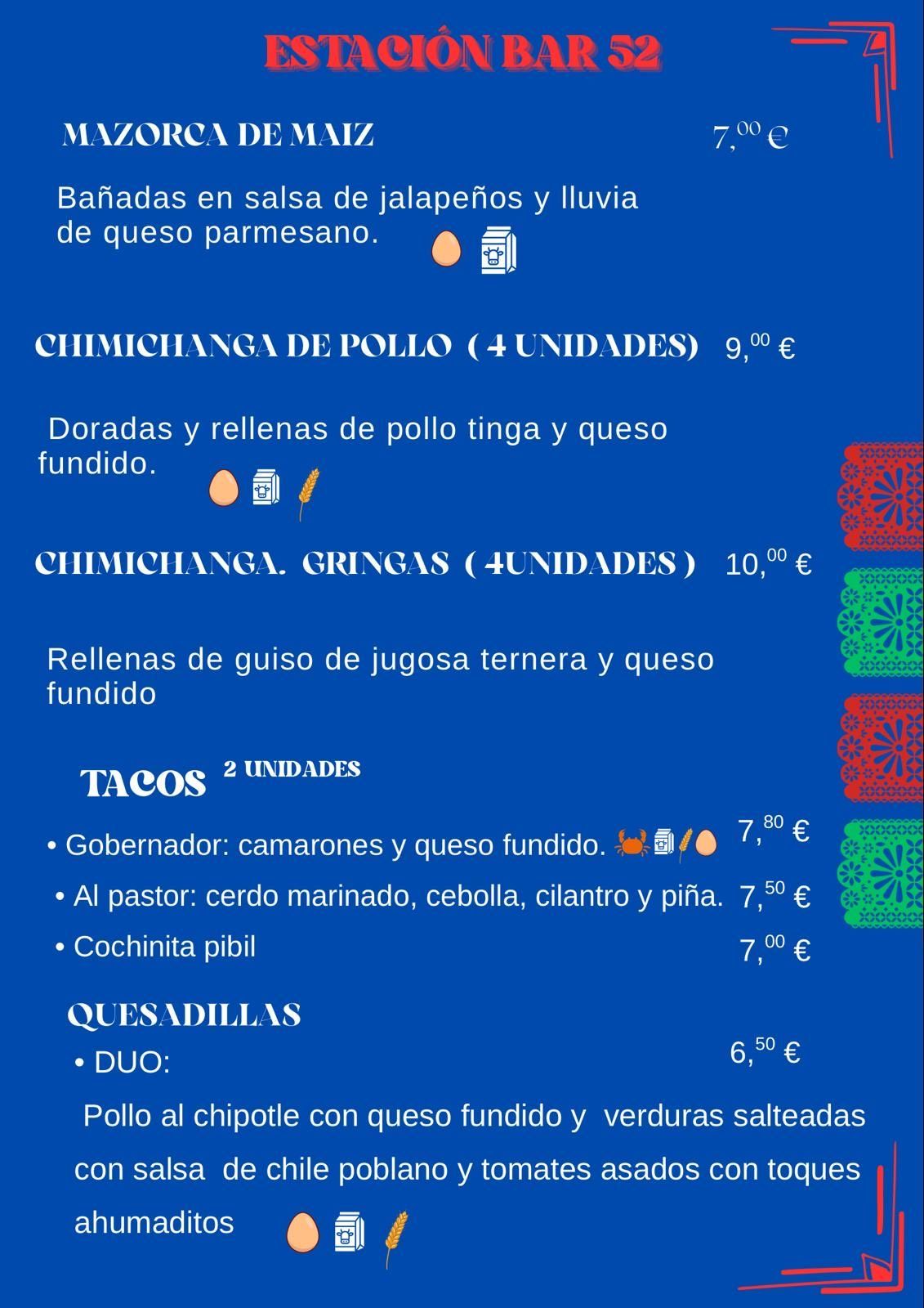 Tablero de menú: artículos de comida y precios, incluyendo maíz, chimichangas, tacos y quesadillas.