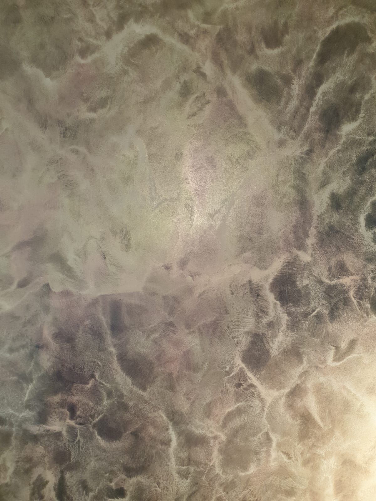 eine Nahaufnahme einer Wand mit einer marmorierten Textur