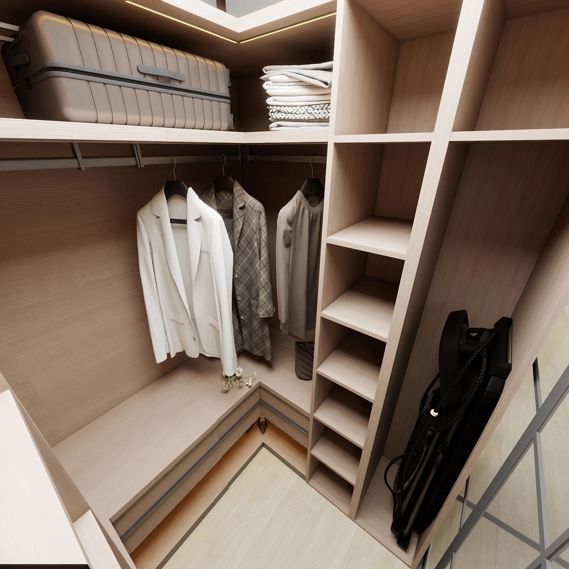 Un dressing d'angle avec des étagères en bois clair, des vêtements suspendus, une valise, du linge plié et un sac de rangement noir.