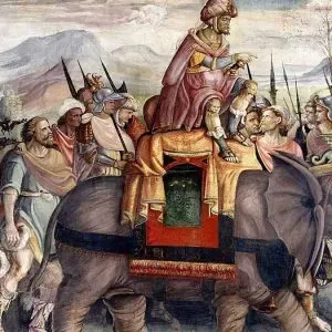 Pintura antigua que representa una procesión con un hombre sentado sobre un elefante, rodeado de asistentes y soldados.