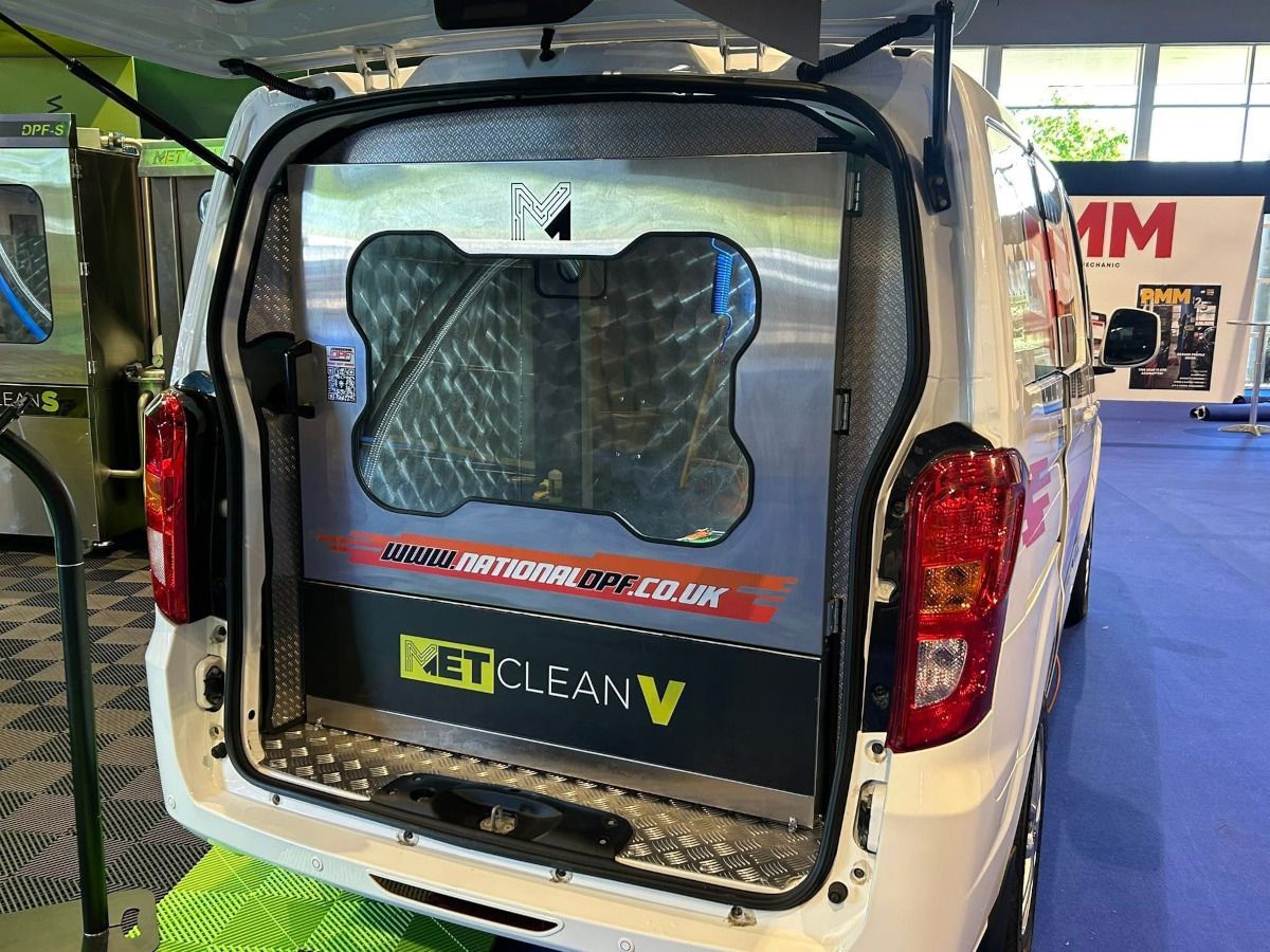 The back of a white van with the trunk open