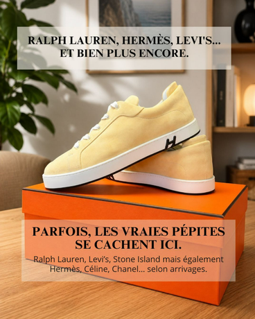 Baskets Hermès jaune pâle posées sur une boîte orange