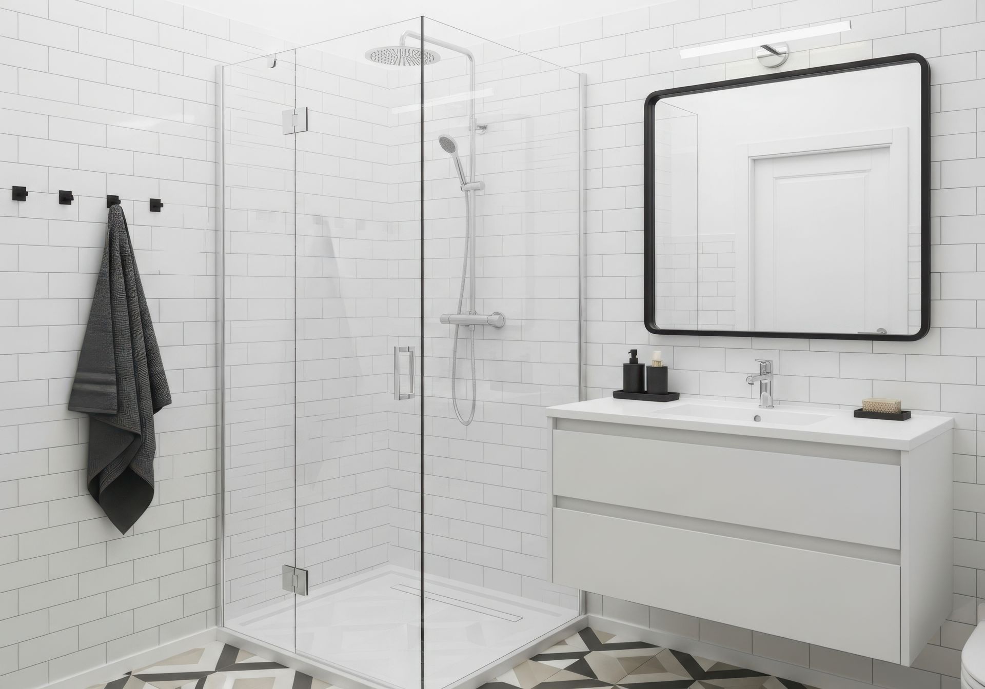 Salle de bains moderne avec douche en verre, vanité blanche et miroir à cadre noir.