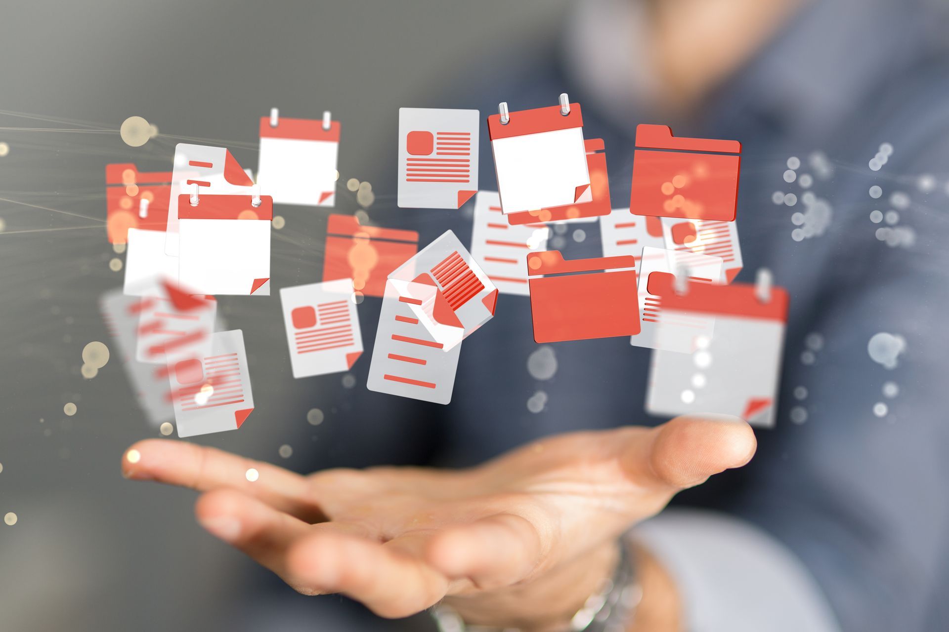 Des pictogrammes de documents au-dessus d'une main ouverte.