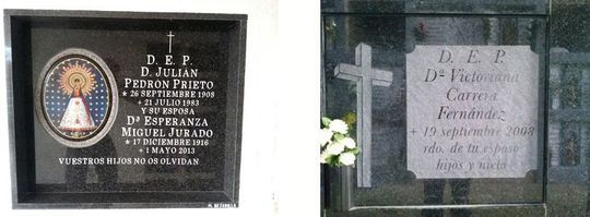 Dos placas en una pared, una de las cuales tiene una cruz.