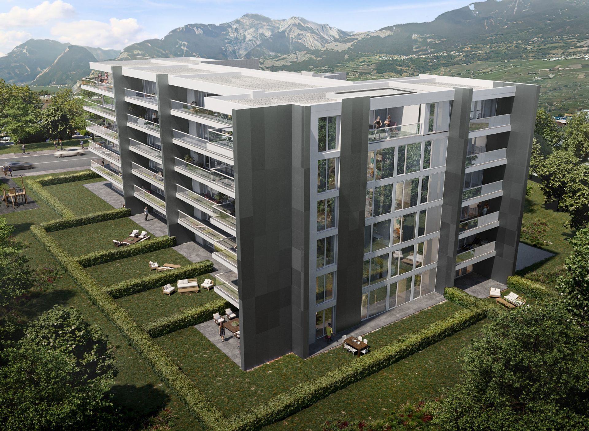 Immeuble d'appartements moderne avec balcons, façade grise et vue sur les montagnes.