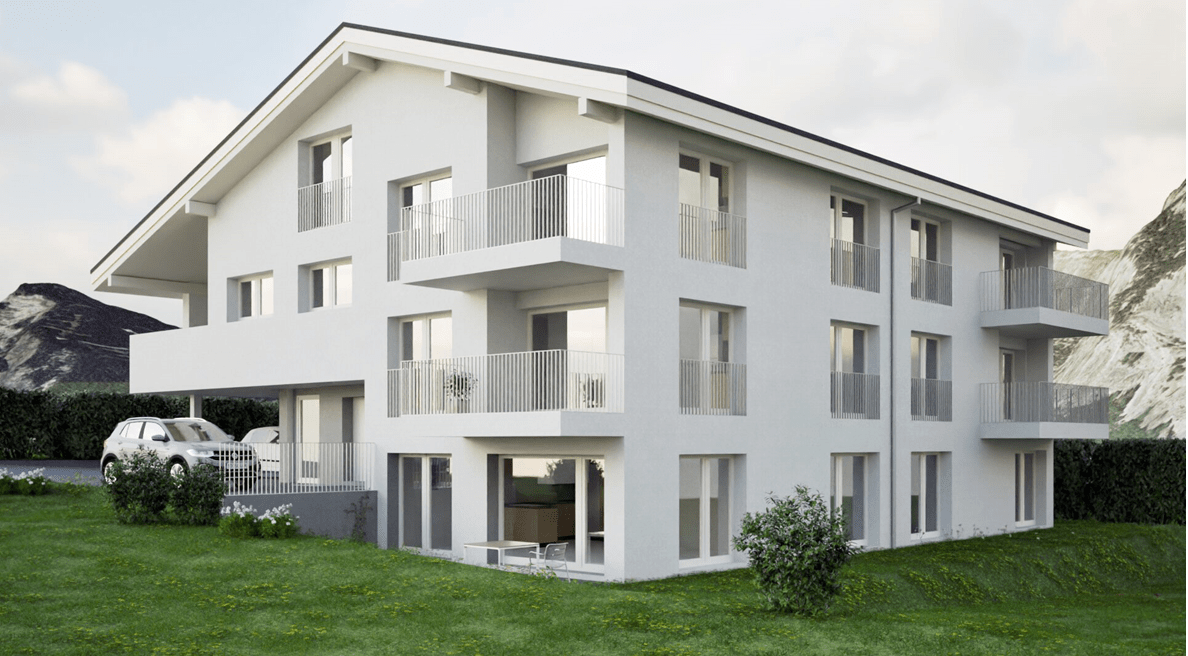 Immeuble blanc à plusieurs étages avec balcons, se détachant sur un fond de montagne, voiture garée devant.
