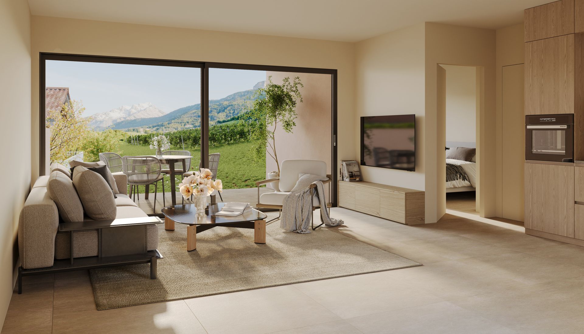 Salon avec canapé, table basse et terrasse avec vue sur la montagne.