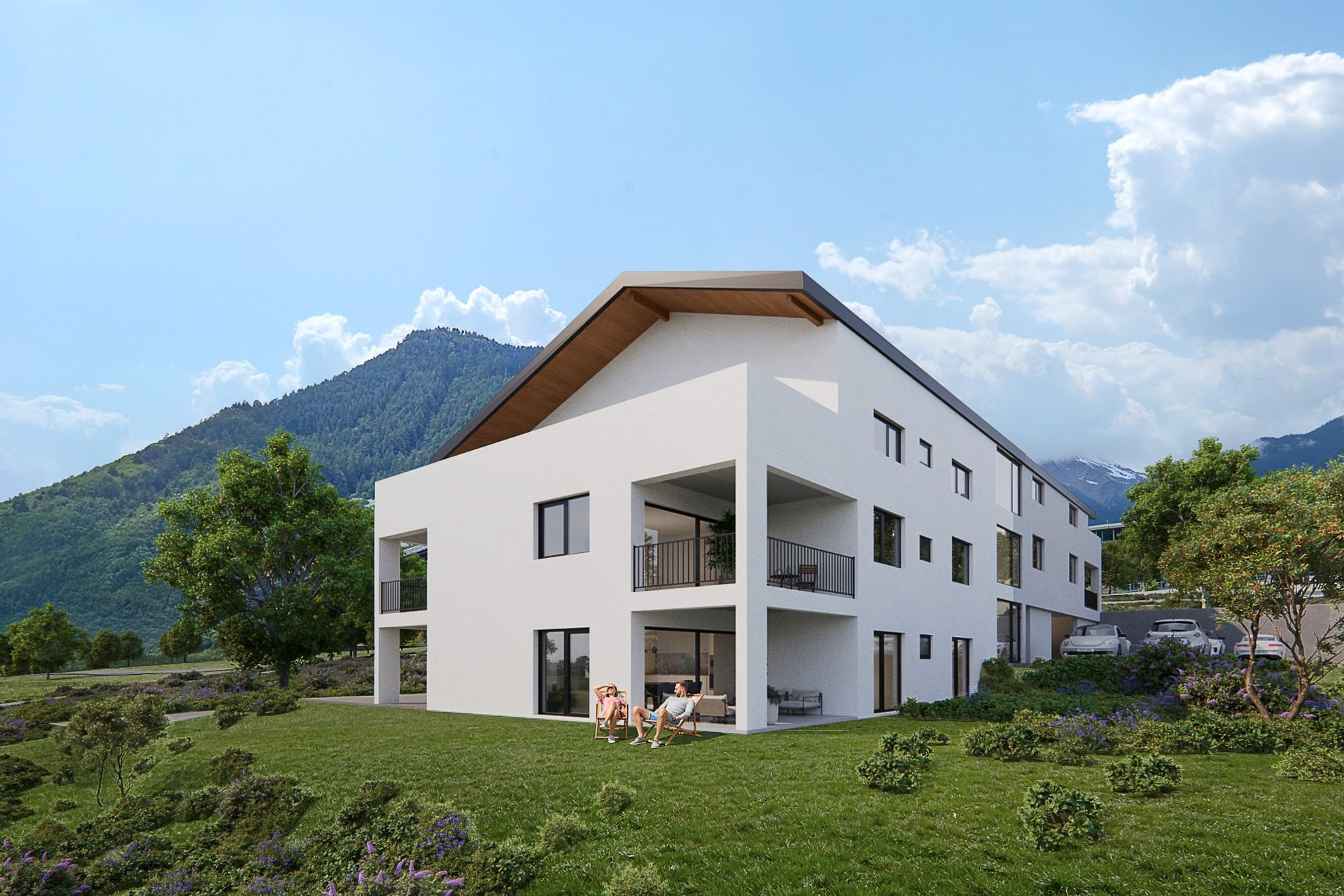 Bâtiment blanc moderne avec balcons dans un paysage montagneux ; des gens sont assis dehors.