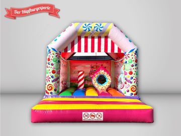 Der Hüpfburgexperte bunte Hüpfburg im Süßigkeiten Design, mit Dach.