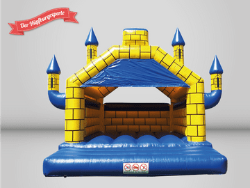 Ein gelb-blaues Hüpfburg, die wie ein Schloss aussieht