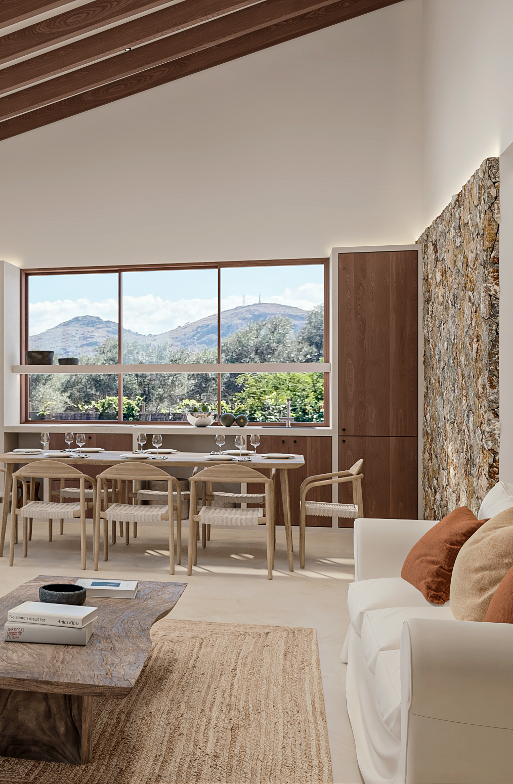 Una sala de estar con un sofá, mesa, sillas y una gran ventana.