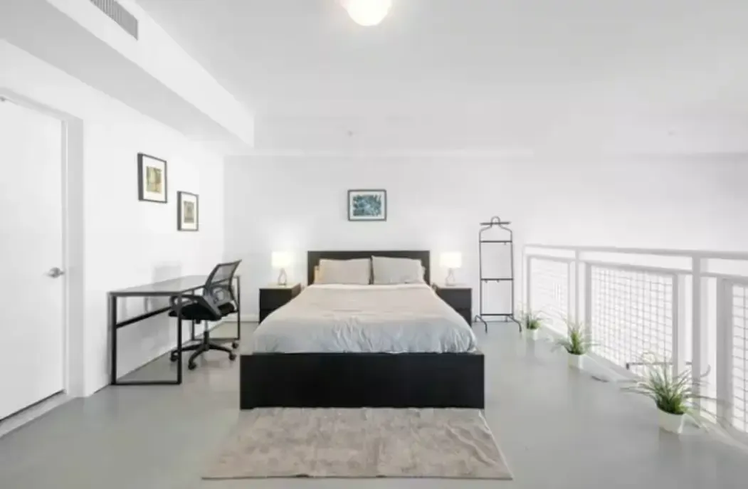 A living room with two couches and a flat screen tv.