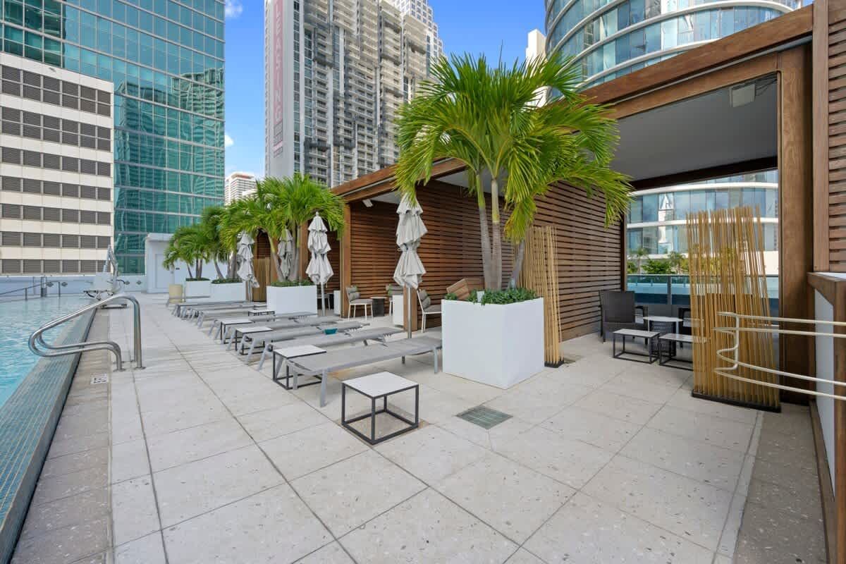 There is a swimming pool on the roof of a building.