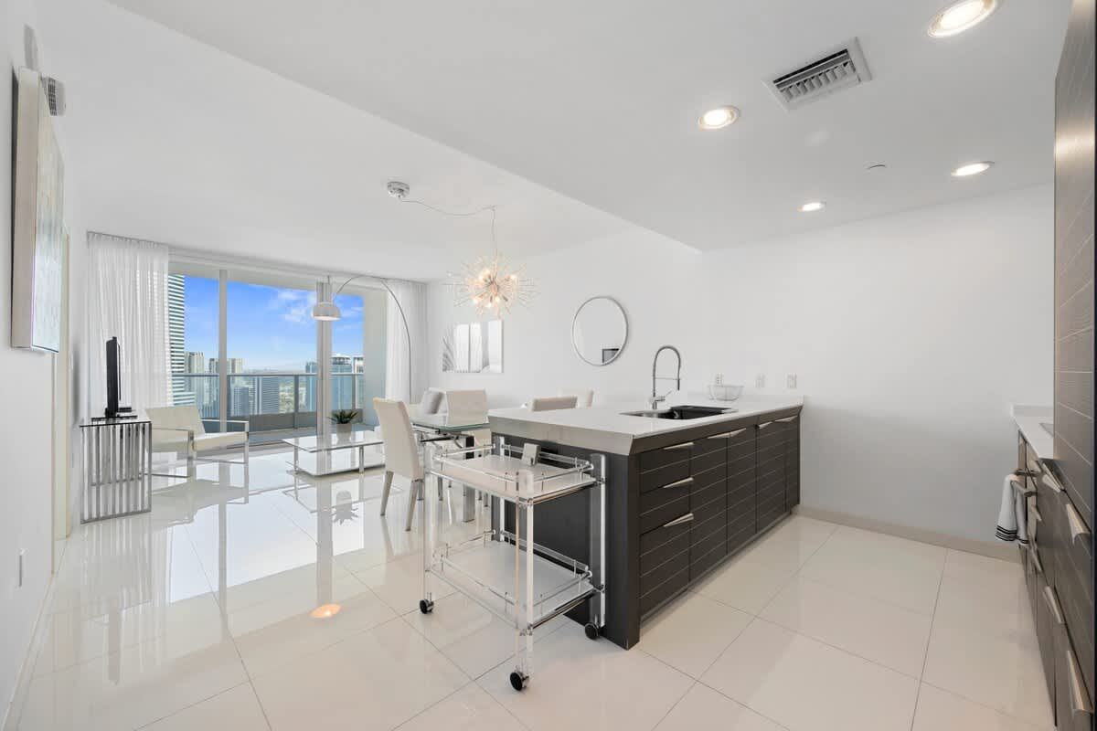 A kitchen with a large island in the middle of the room.