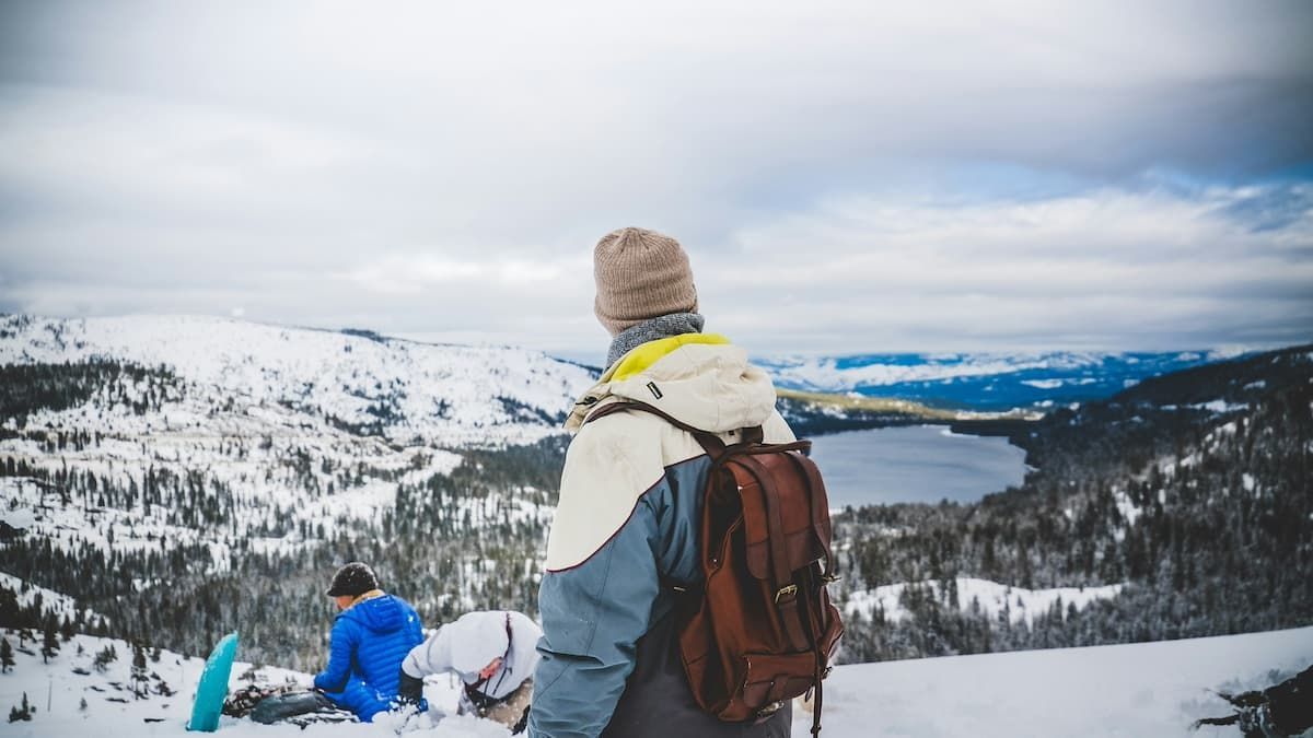 Elevated view of Donner Lake at night with stars in the sky and lights all around the lake