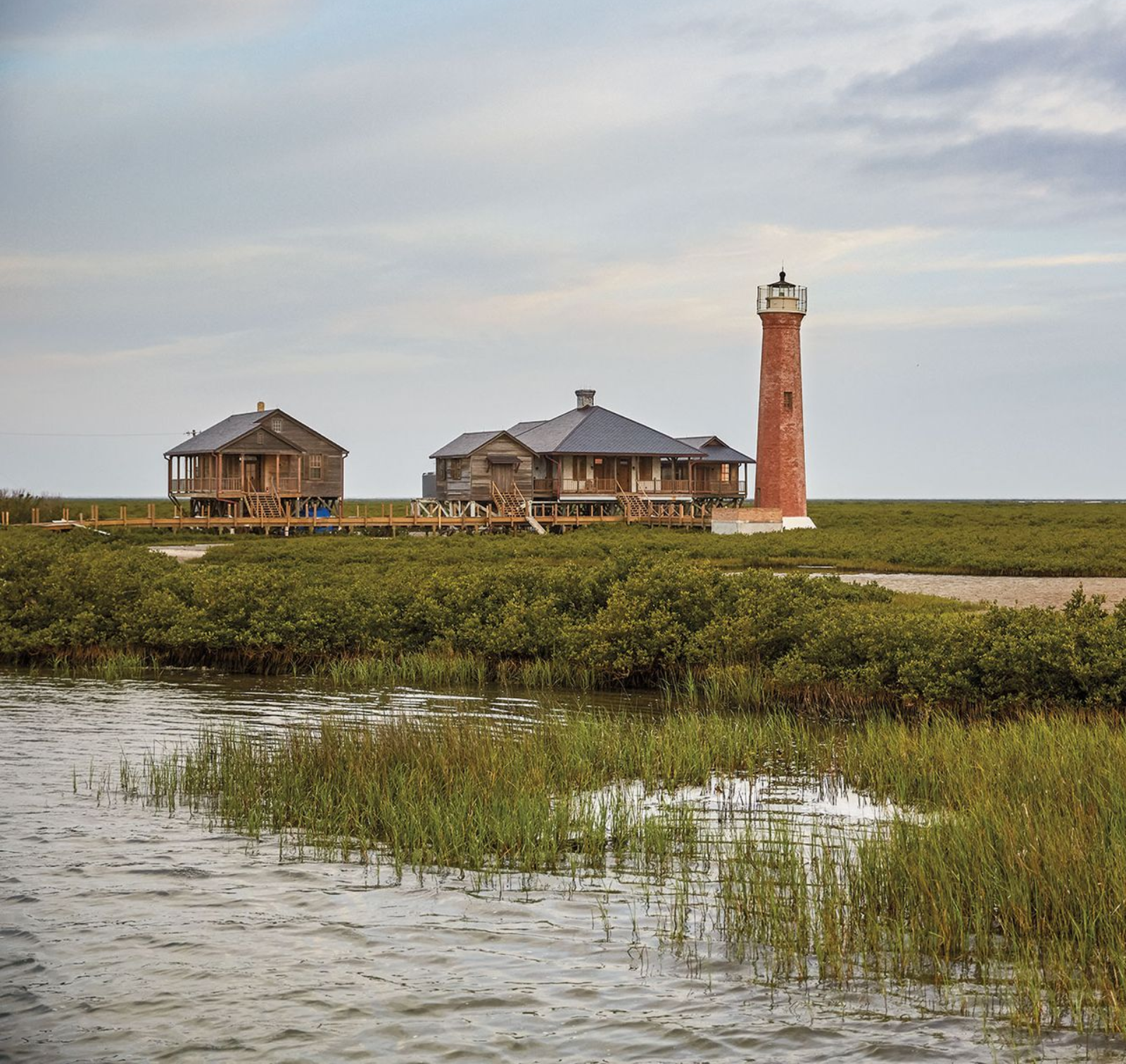 An aerial view of a beach with a lot of tents and cars in Rockport, Texas