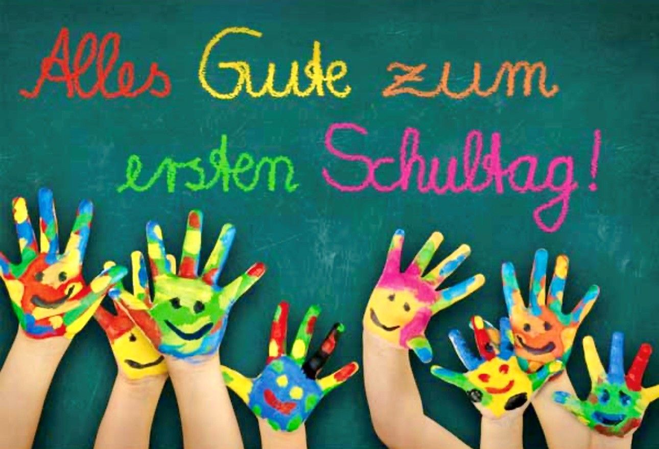 Hands with painted smiley faces under colorful 