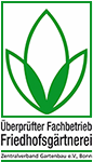 Das Logo der Friedhofsgärtnerei ist eine grüne Blume mit drei Blättern.