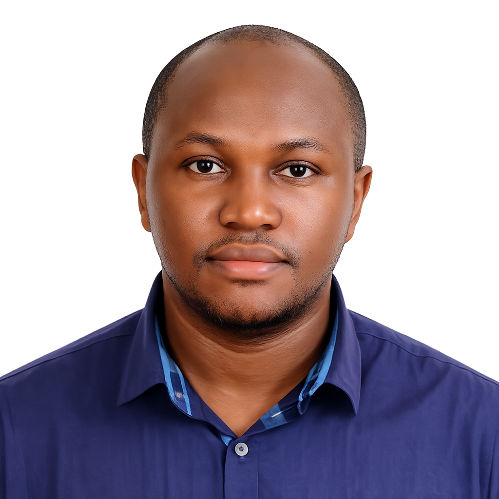 Studio headshot of a man in a blue collared shirt on a white background