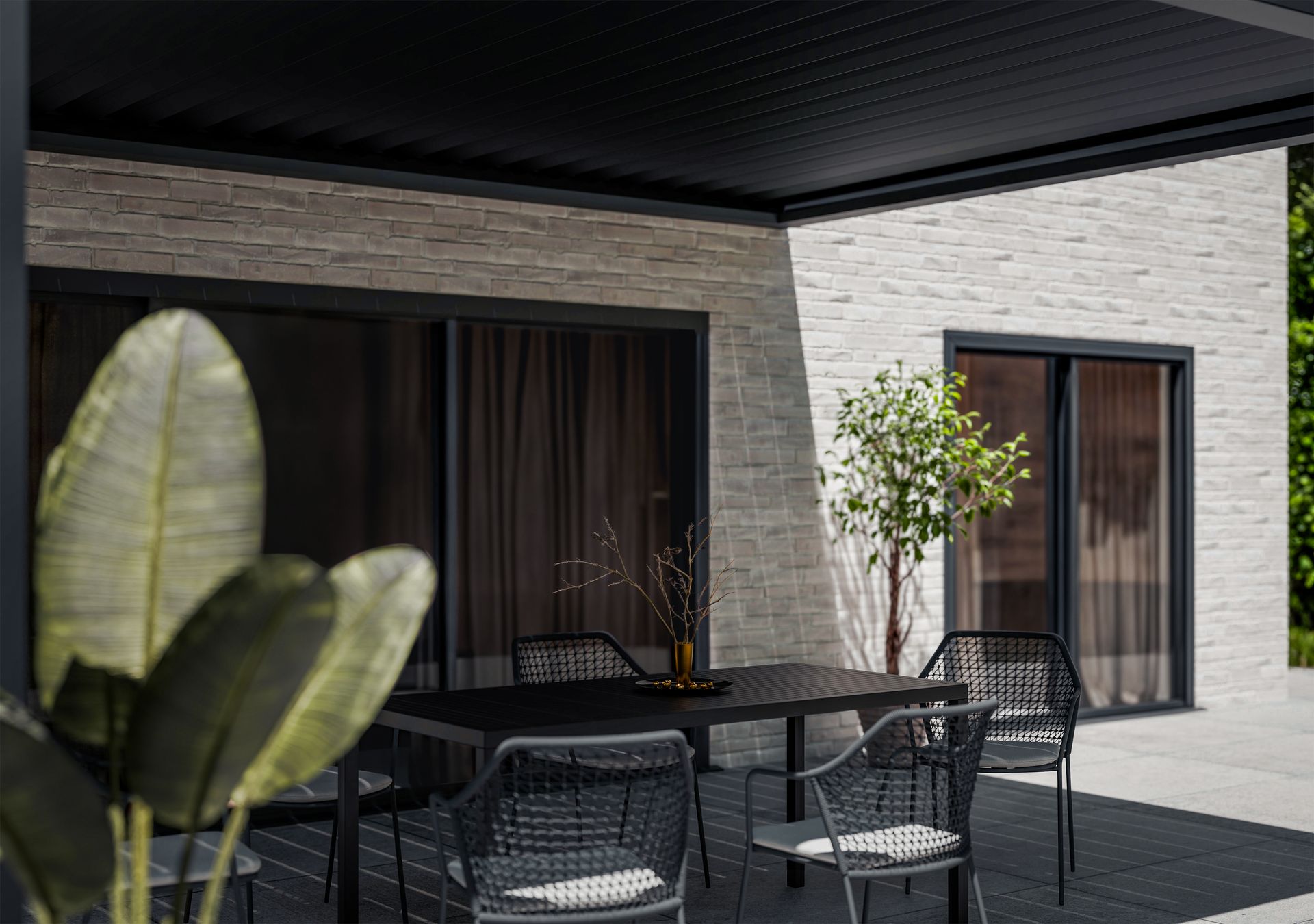 Une terrasse sous une pergola.