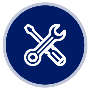 Una llave inglesa y un destornillador están cruzados en un círculo azul.