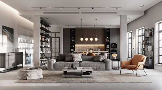 Moderno espacio de estar de planta abierta con cocina, sala de estar y tonos neutros; sofá, silla, estanterías.