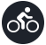 Una persona va en bicicleta dentro de un círculo negro.