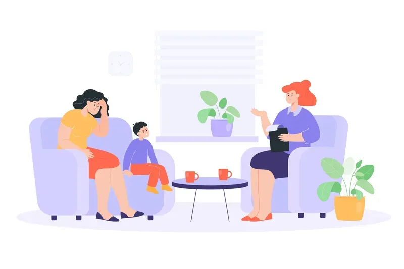 Mujer y niño en sesión de terapia con terapeuta, en el interior.