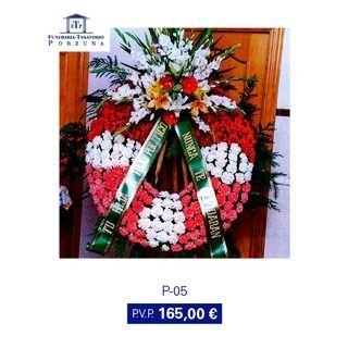 Corona de flores rojas y blancas con lazo verde y texto "Nunca te olvidaré". Precio: 165,00 €.