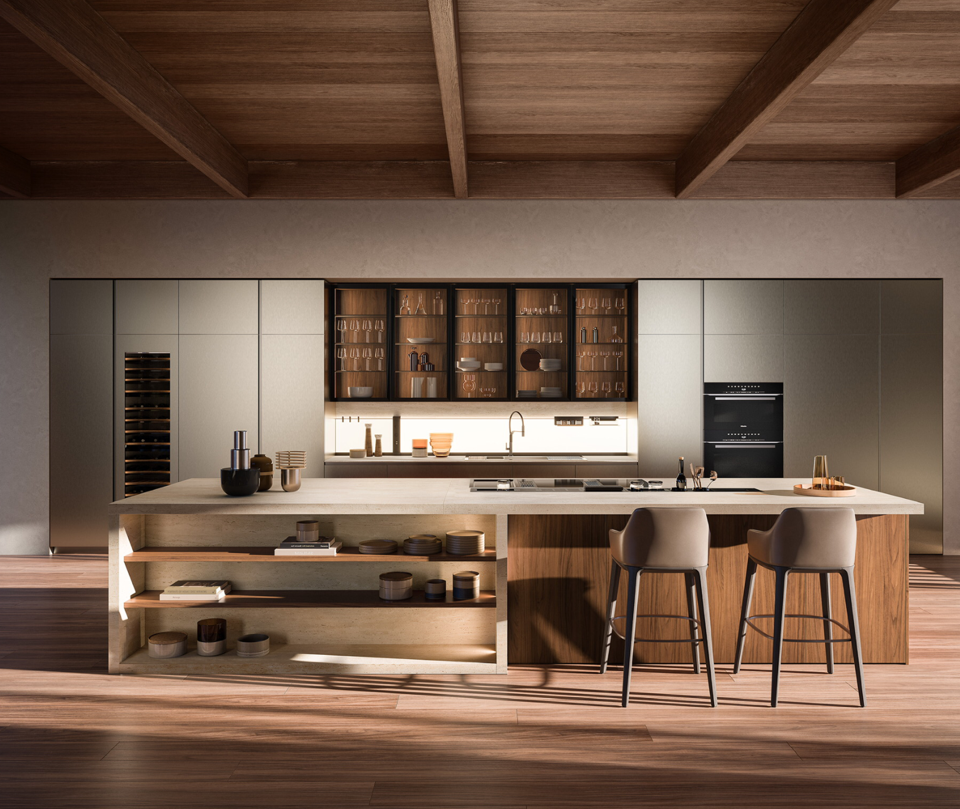 Cuisine moderne avec îlot en bois, meubles clairs et cave à vin. Deux tabourets de bar sont à l'avant.