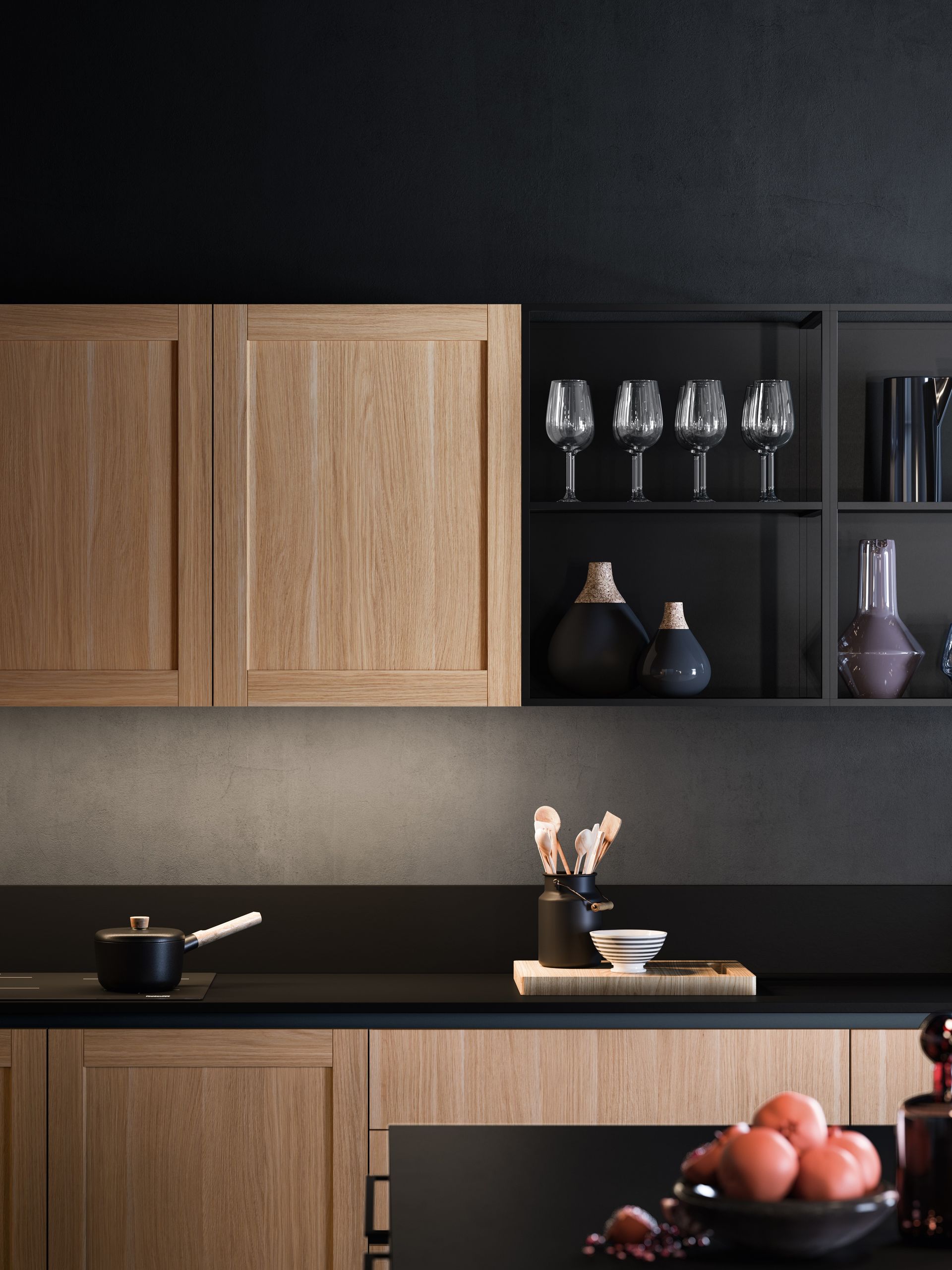 Cuisine moderne avec armoires en bois, comptoirs noirs et murs sombres ; avec verrerie et décoration.