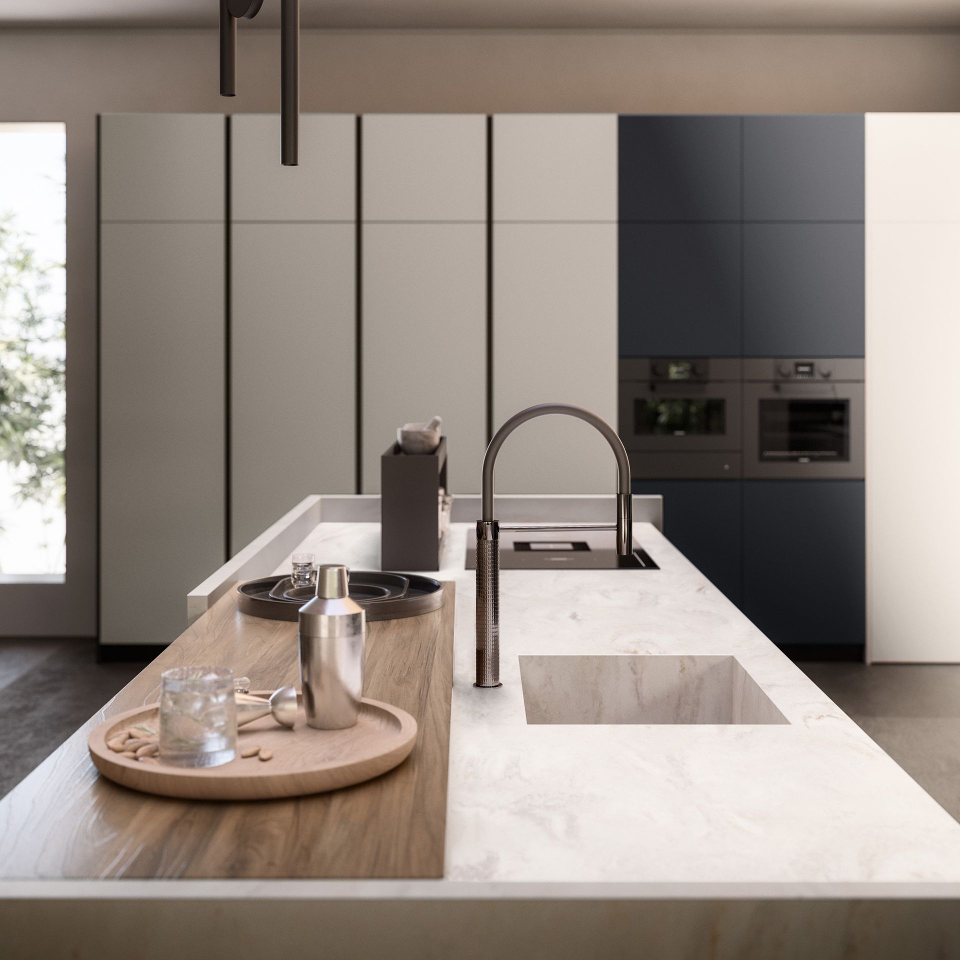 Cuisine moderne et minimaliste avec un îlot blanc, un évier, un plateau en bois et des appareils électroménagers encastrés de couleur sombre