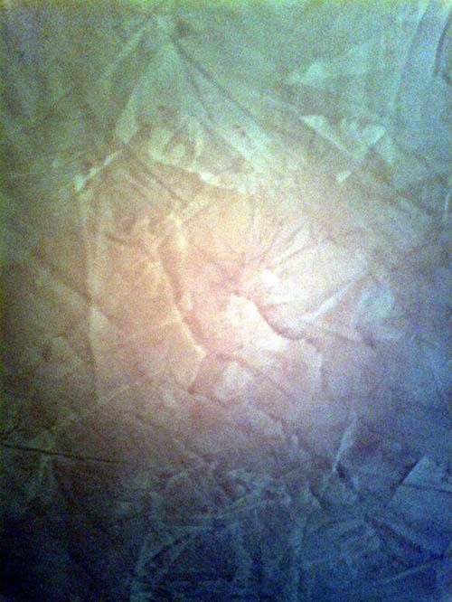 Un primer plano de una pared con textura de mármol.