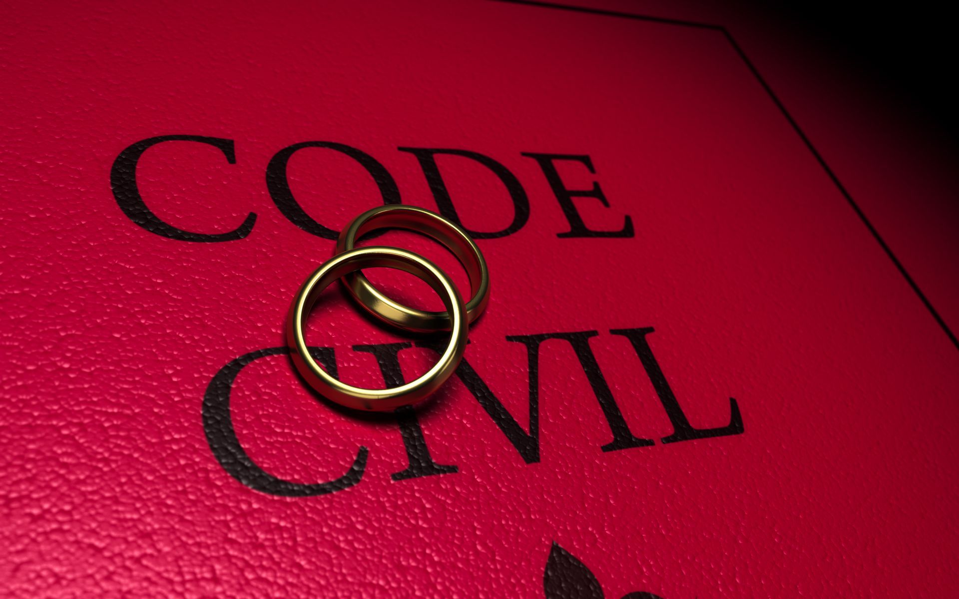 Livres rouges, Code civil, empilés sur une surface noire réfléchissante.