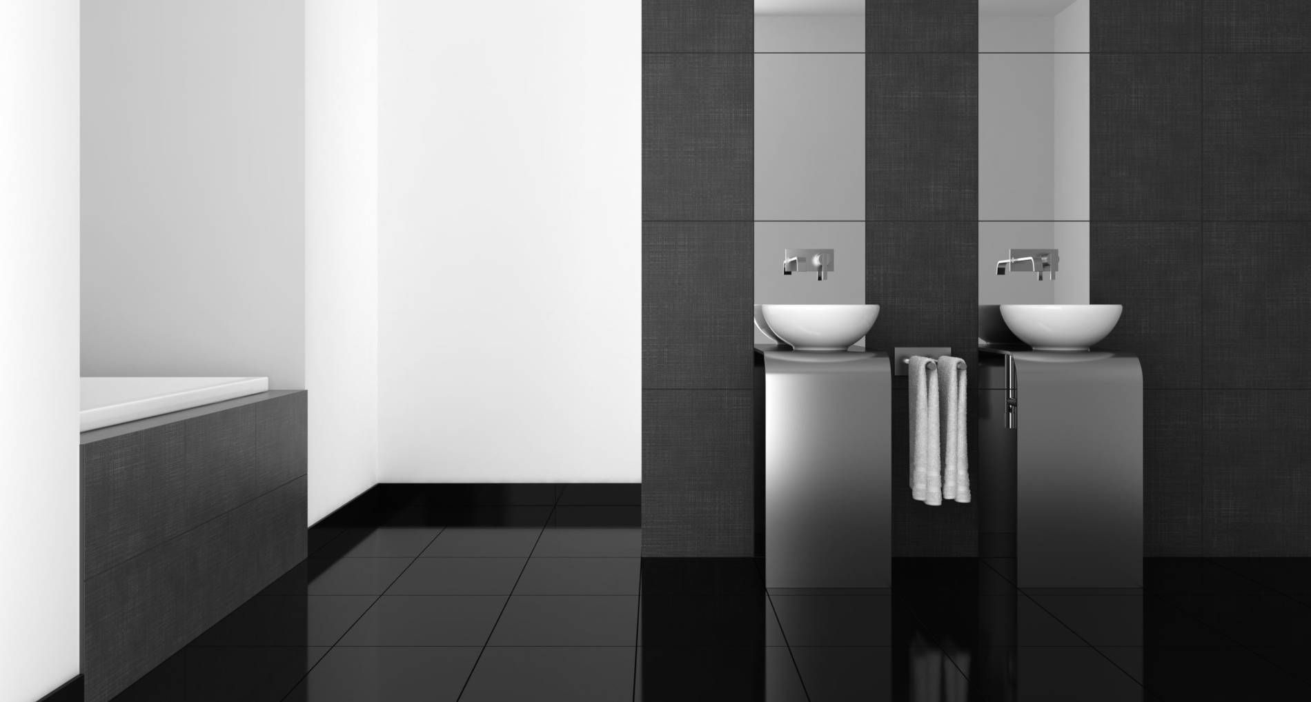 Baño moderno en blanco y negro con dos lavabos con pedestal, espejos altos y una elegante bañera.