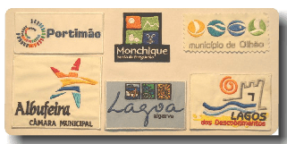 Patches of municipal logos, including Portimão, Monchique, Olhão, Albufeira, Lagoa, and Lagos, on a beige background.