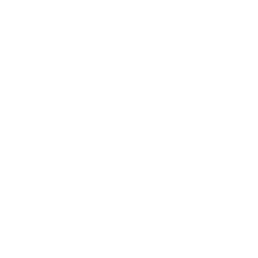 Primer plano de un pequeño girasol de color amarillo brillante con el centro marrón oscuro, sobre un fondo verde difuminado.