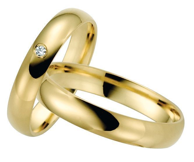 Trauringpaar aus Gold, einer mit Stein