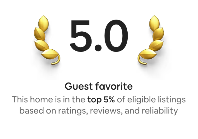 Guest favorite badge: 5.0 rating flanked by gold laurel wreaths; text notes the home is in the top 5% of eligible listings.