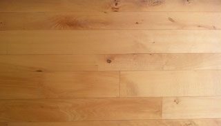 Es ist eine Nahaufnahme eines Holzbodens.