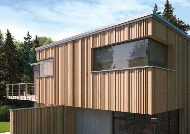 Ein Haus mit vielen Fenstern und einem Balkon